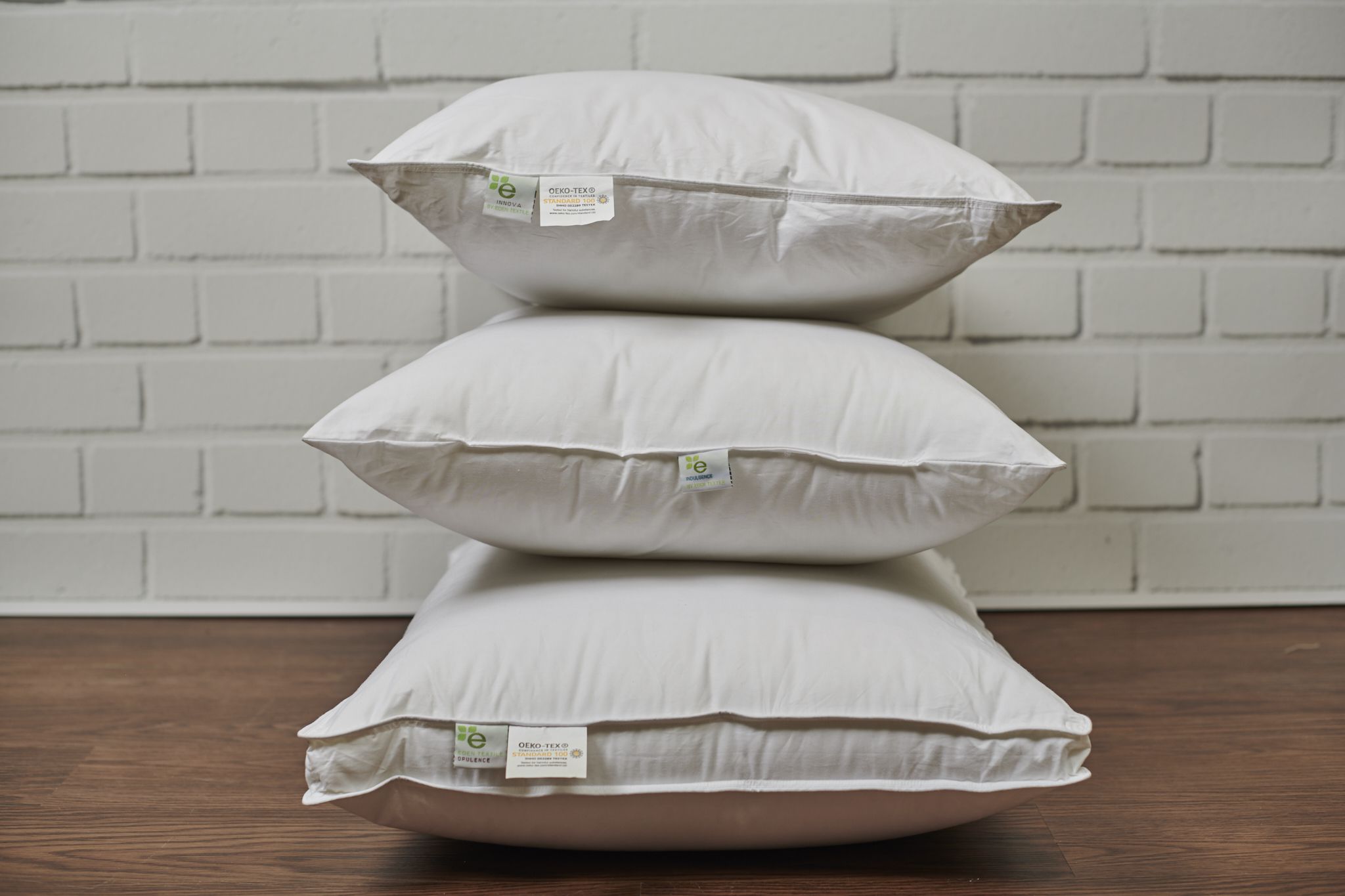 Stack of Different Kinds of Eden Textile Quality Pillows 